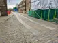 Paved Roadway Extending From West Side Of House Mill To Wall And Gate On East Side Of Clock Mill