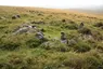 A partly enclosed stone hut circle settlement on Kennon Hill