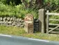 Milestone opposite Crickle Farmhouse