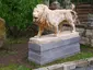 Statue of a lion near the entrance to the Artist garden in Nusle (left)
