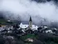 Saint-Romain church with bell tower and surroundings